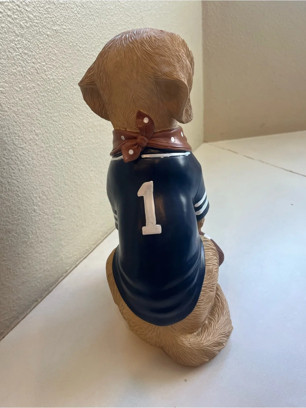 Brown Labrador Dog Figurine holding Football and Wearing a #1 Jersey